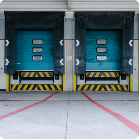 Large warehouse roll-up door opens for an industrial warehouse