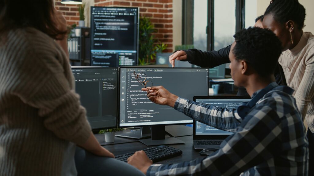 A team of software engineers programming a custom software solution