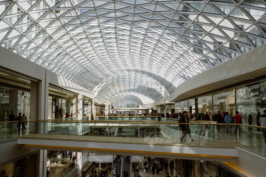 Retail stores and shoppers in an ultra-modern shopping mall
